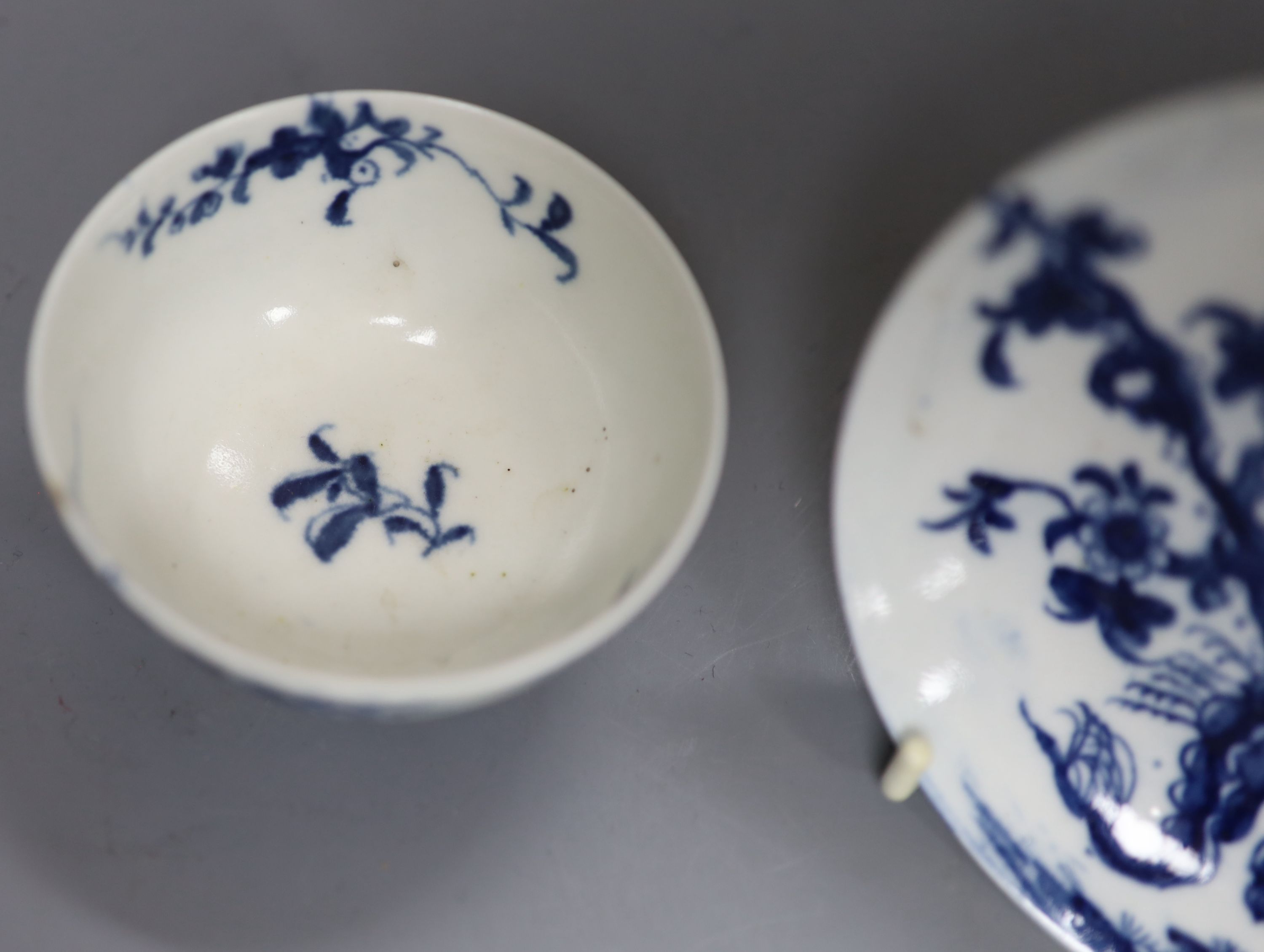 An 18th century Worcester prunus root pattern tea bowl and saucer, diameter 11.5cm, early large crescent mark to both